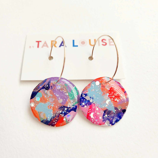 By Tara Louise Rainbow Galaxy resin circle hoop earrings for women white background